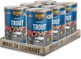Six cans of Belcando Baseline Trout dog food arranged in a wooden tray that reads 'MADE IN GERMANY' on a clean white background.