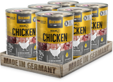 Six cans of Belando Baseline Chicken wet dog food arranged in a wooden tray with 'MADE IN GERMANY' printed on the front, on a clean white background.