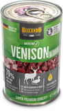 A can of Belcando Baseline Venison & Duck dog food, featuring a green and black label with a photo of raw venison and duck meat, set against a plain white background.