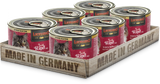 A pack of six LEONARDO Beef with Venison & Sweet Potatoes cat food cans, placed on a wooden tray with 'Made in Germany' printed on it.