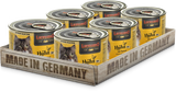 A pack of six cans of LEONARDO chicken cat food with spinach, placed on a wooden tray with 'Made in Germany' printed on it.