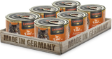 A pack of six cans of LEONARDO brand cat food, with each can labeled as containing Duck with Chicken & Carrots. The packaging indicates the product is made in Germany.