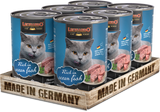 Leonardo cat food cans with ocean fish flavor, made in Germany, arranged in a wooden tray.